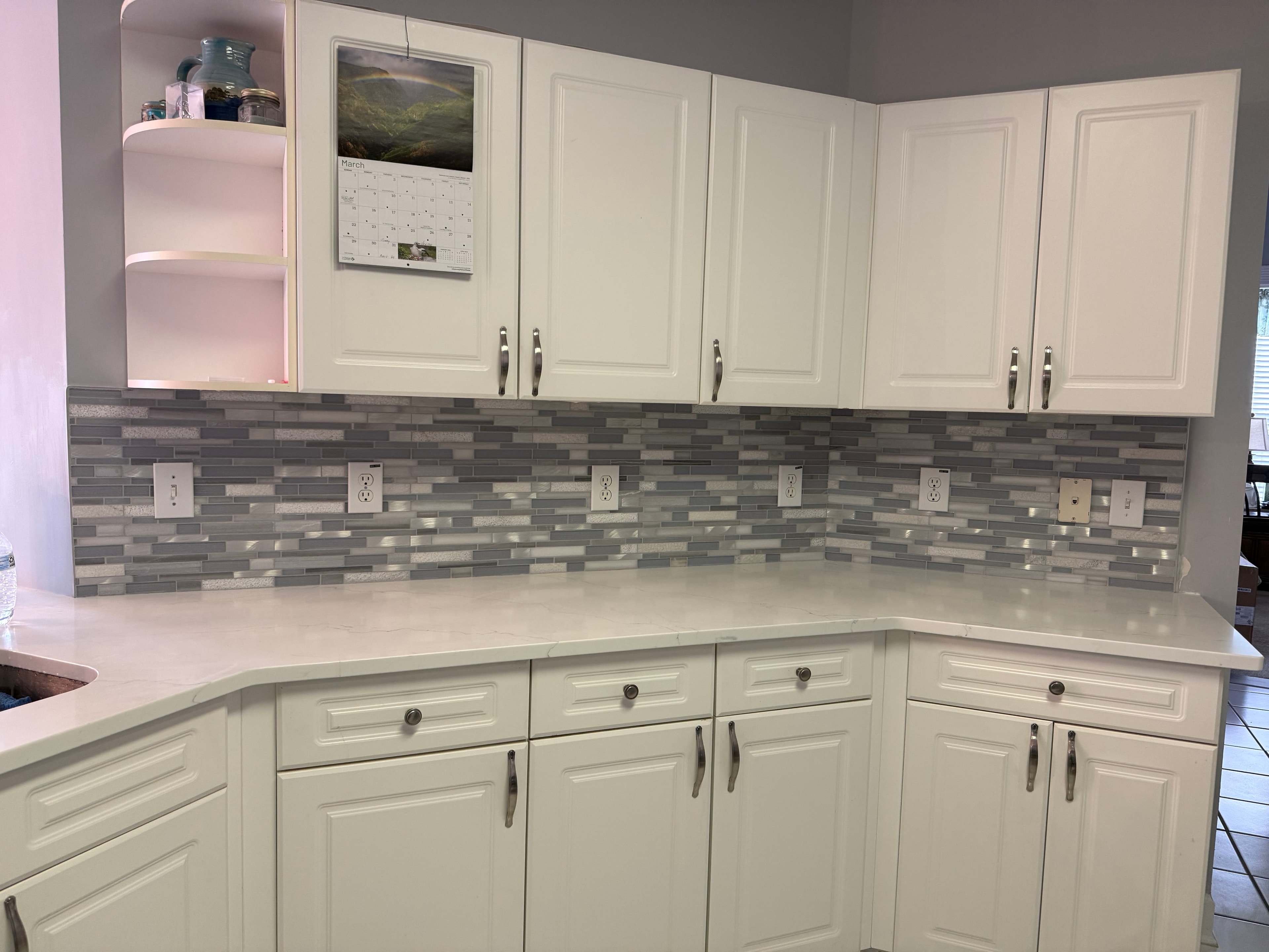 Kitchen tile backsplash with white cabinetry
