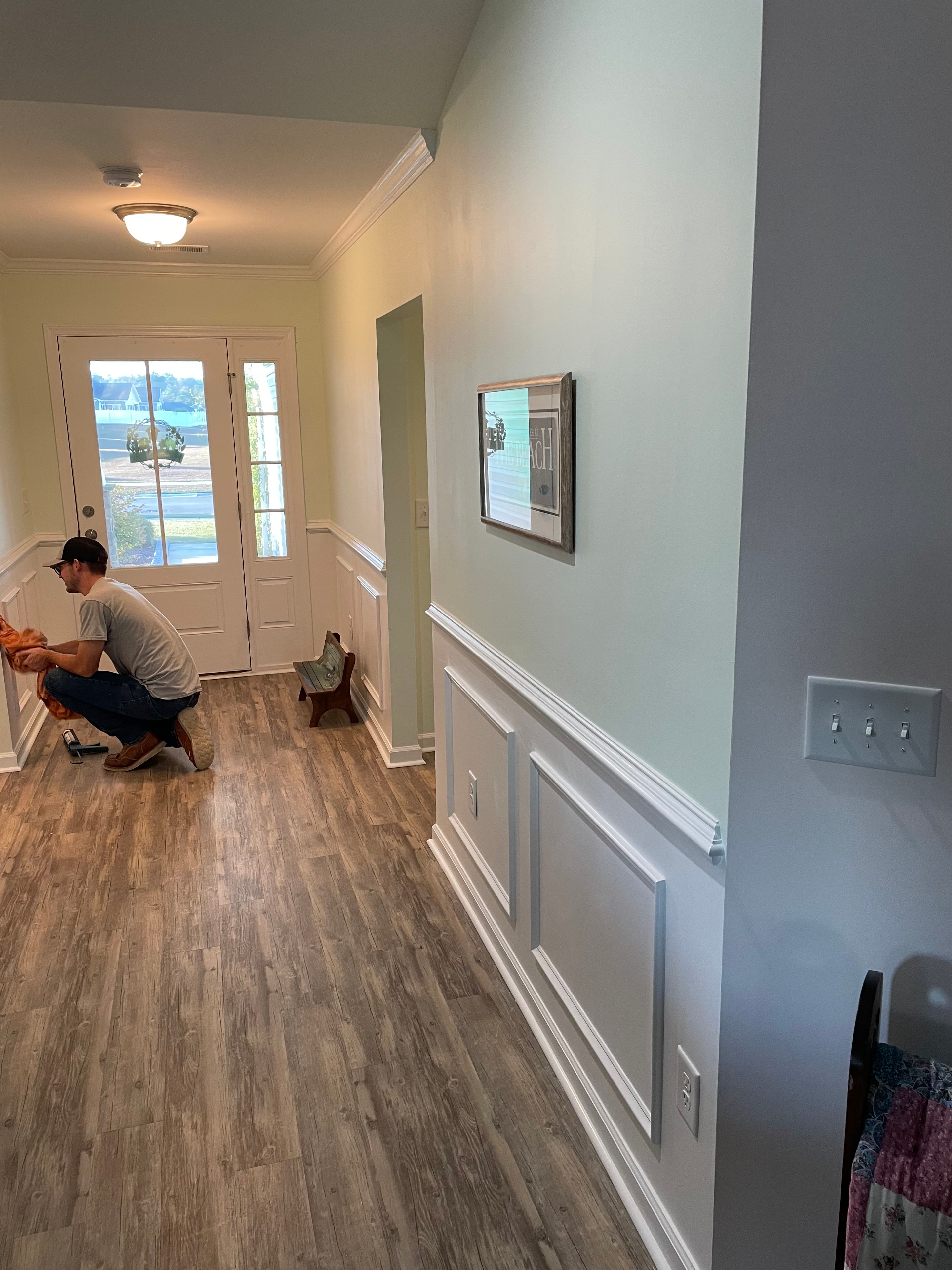Interior renovation with crown molding and flooring