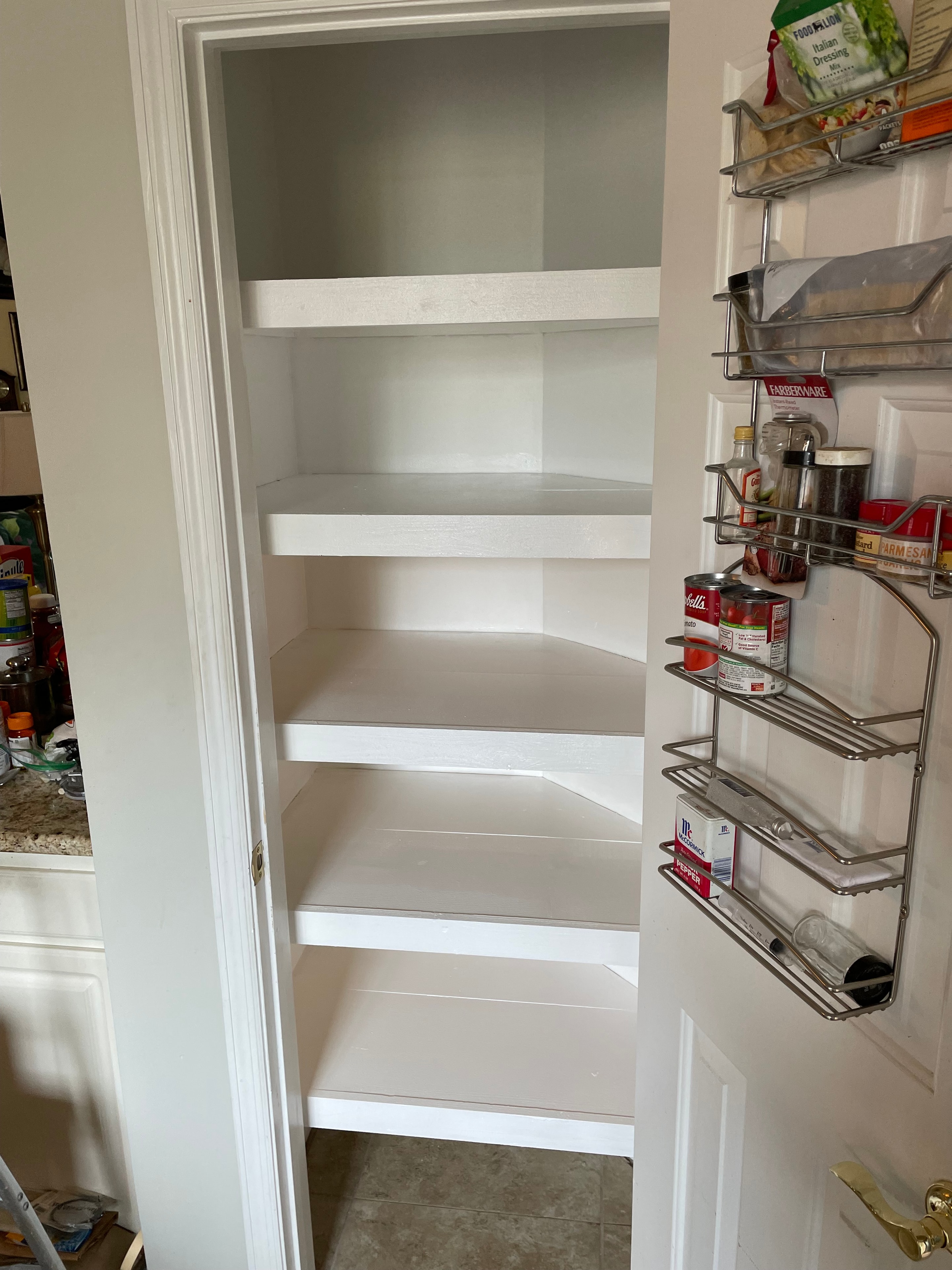 Custom pantry door organizer with pull-out shelving