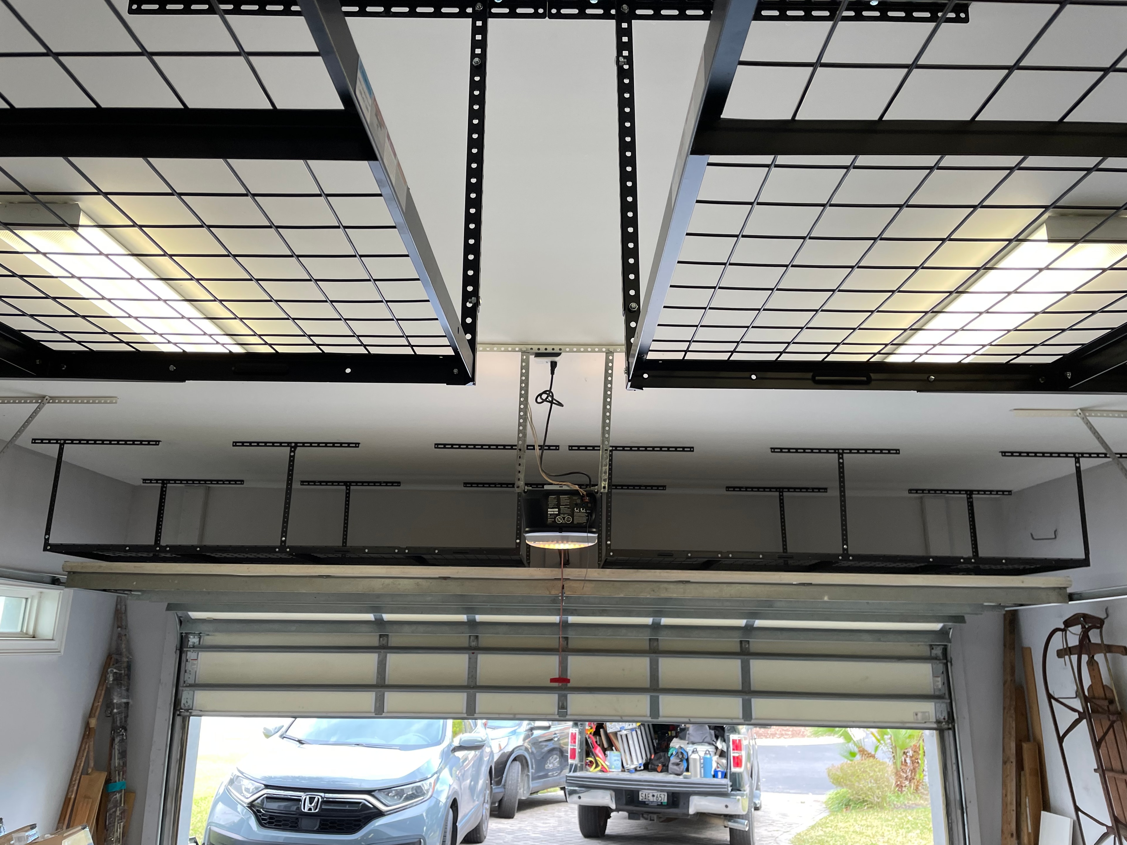 Garage ceiling storage rack and overhead shelving installation