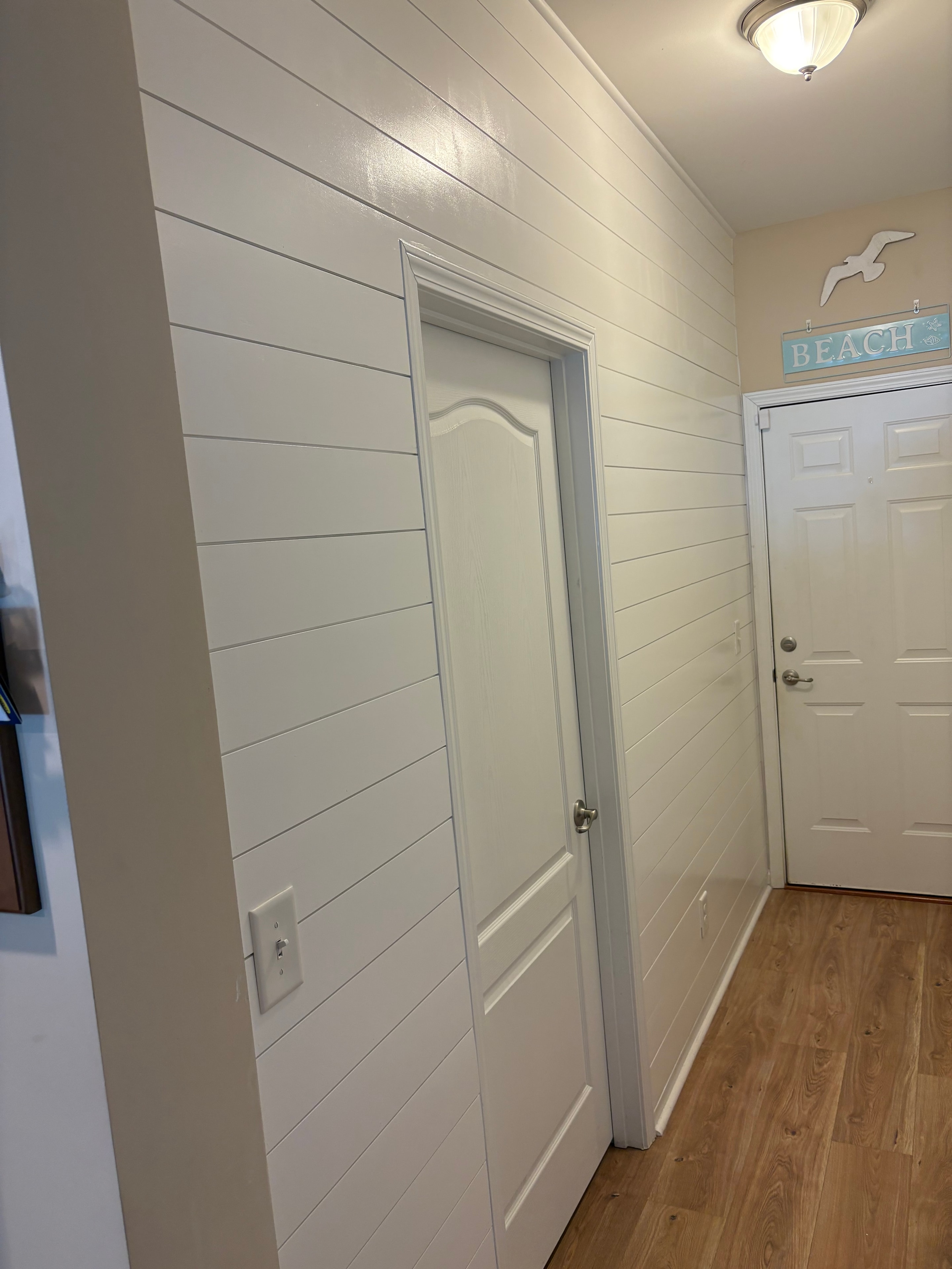 Interior shiplap flooring and attic access panel